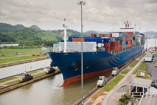A cargo ship enters the Panama Canal at Miraflores Locks in an undated photo. Low water levels have caused a backlog of container vessels at the Panama Canal, and that could impact the ability of businesses to restock inventories in time for the holiday shopping season. 