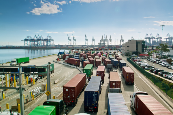 Trucks wait to enter the Port of Los Angeles. A bump in imports to the U.S. could be on the horizon, following a strong back-to-school season that indicate cargo volumes could reach 2 million TEUs during September and October.